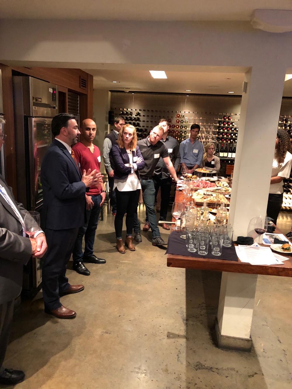 Alumni gathered at reception in Wine cellar